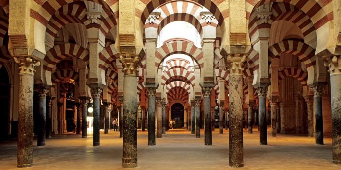 Spain, Andalusia, Cordoba, praying hall inside the Mezquita (Mosque cathedral) Andalusia Arab Civilization Architecture Building cathedral Church Civilization colonnade Column Cordova Europe historical religions History Horizontal Indoors Landmark Monument Mosque No People Religion religions Religious Religious building Spain the Arabian Andalusian architecture UNESCO World Heritage Site